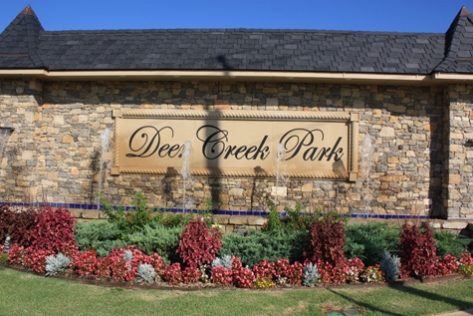 Entrance sign to Deer Creek Park neighborhood. Very pretty dual entrance, with fountains.